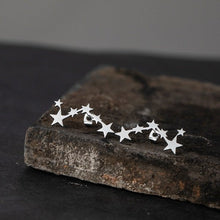 Aretes de acero inoxidable 6 estrellas plateado.